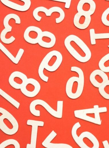 white numbers spread out across orange background