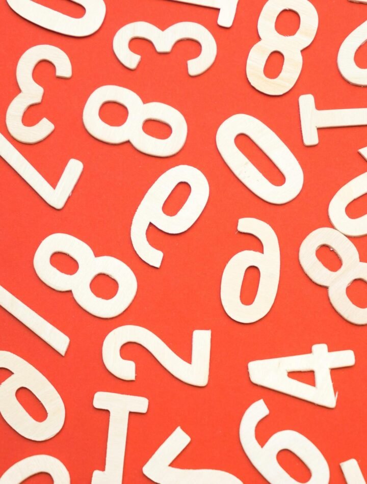 white numbers spread out across orange background